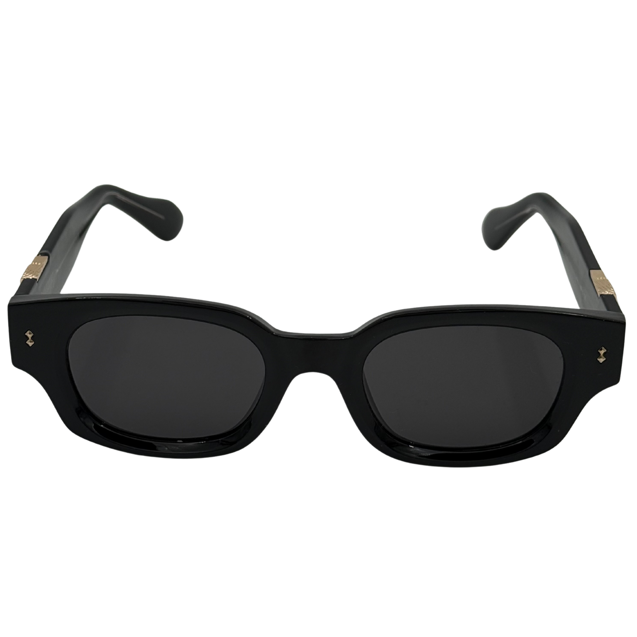 Black sunglasses with gold accents on a white background