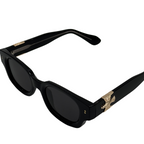 Sunglasses with tortoiseshell frame and eagle emblem on a white background