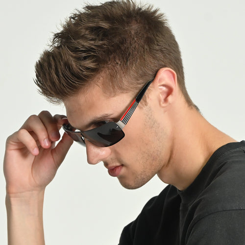 Man wearing sunglasses with a neutral background