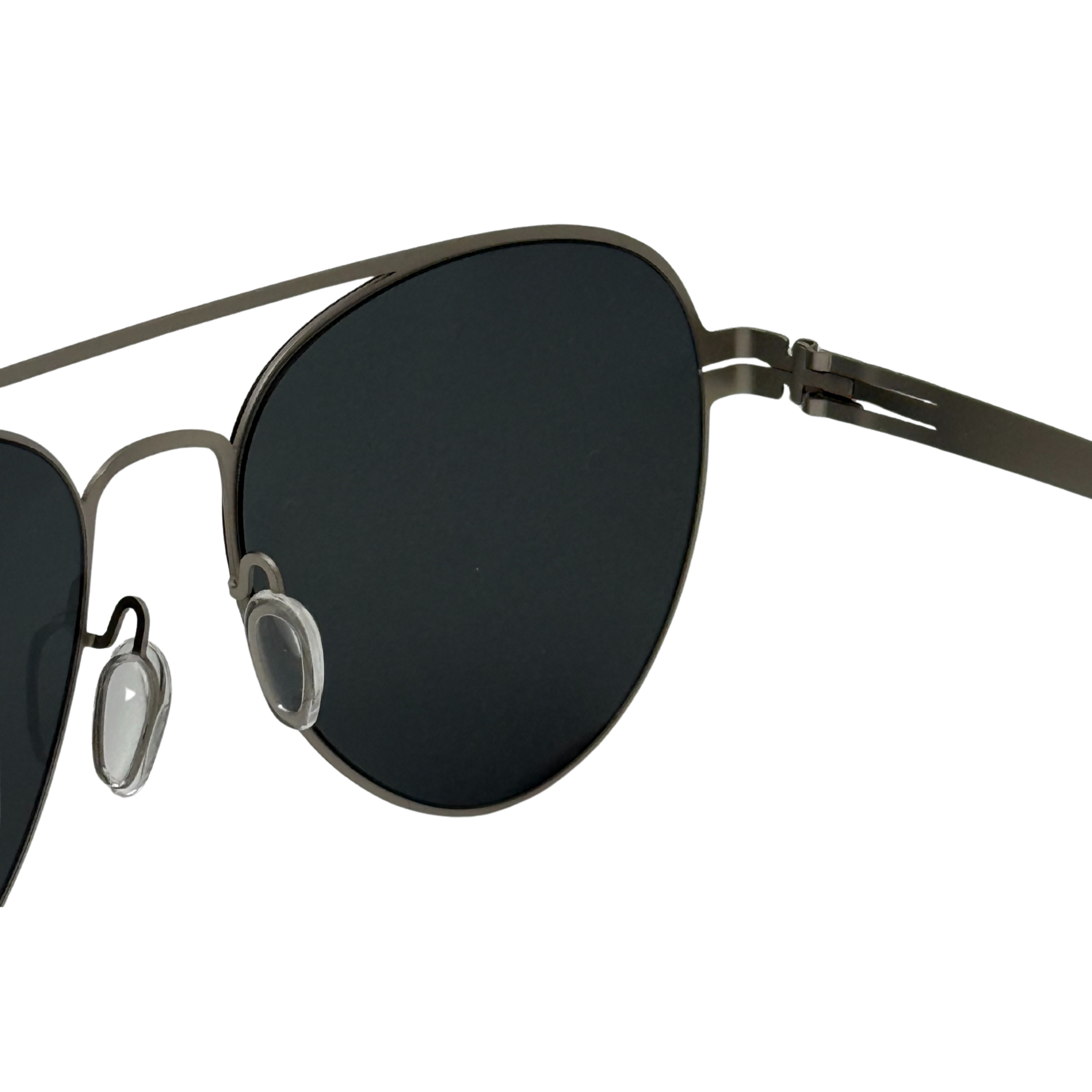 Sunglasses with black lenses and thin metal frame on a white background