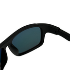 Black sunglasses with a clear lens on a white background
