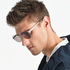 Man wearing sunglasses with a neutral background