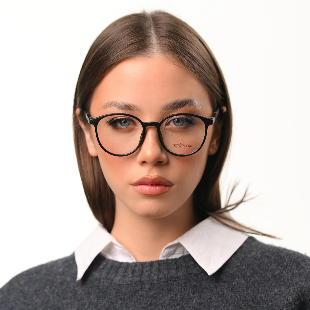 Woman wearing glasses with a plain background