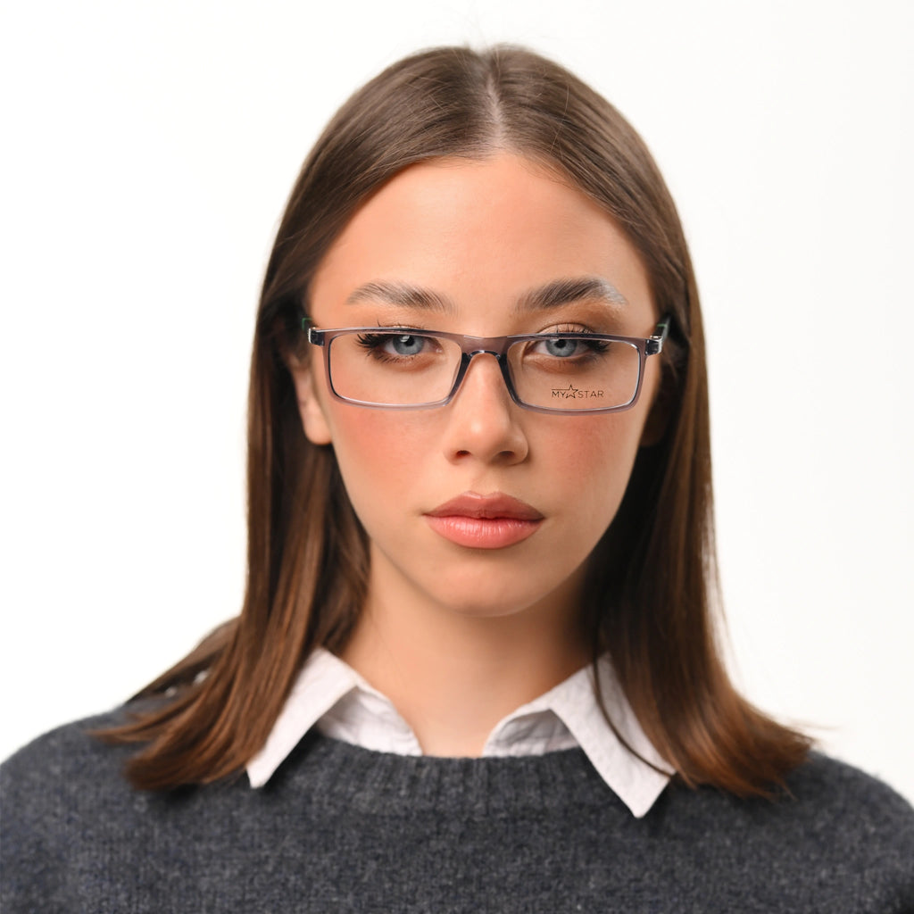 Woman wearing glasses with a plain background