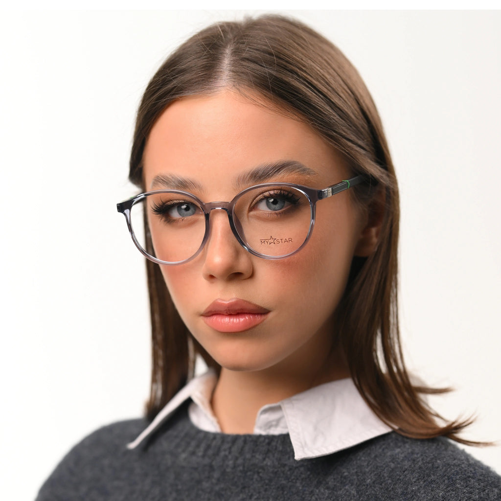 Woman wearing glasses with a neutral background