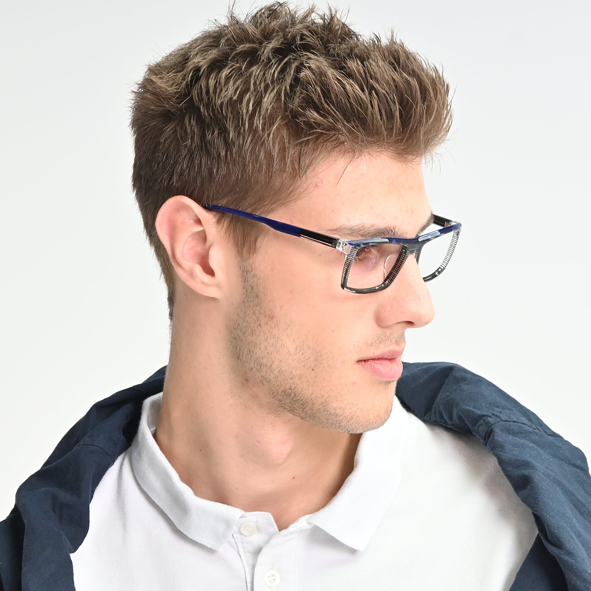 Man wearing glasses with a blue frame on a white background