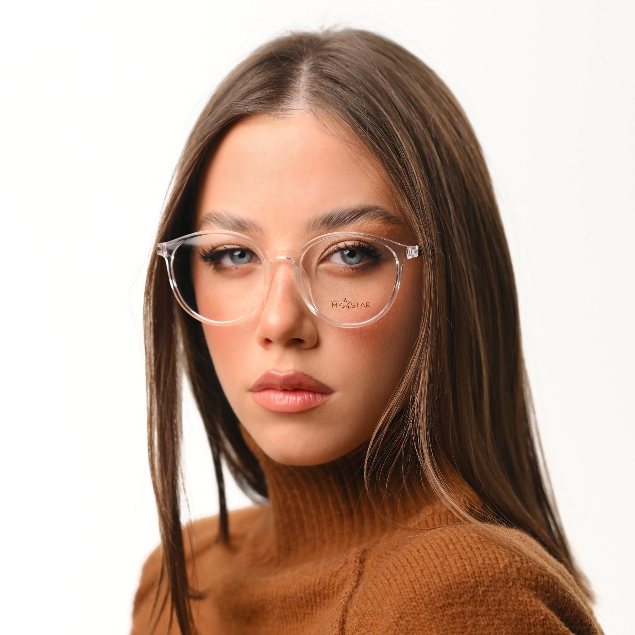 MyStar BOLD transparent prescription glasses on a woman wearing a brown turtleneck sweater.
