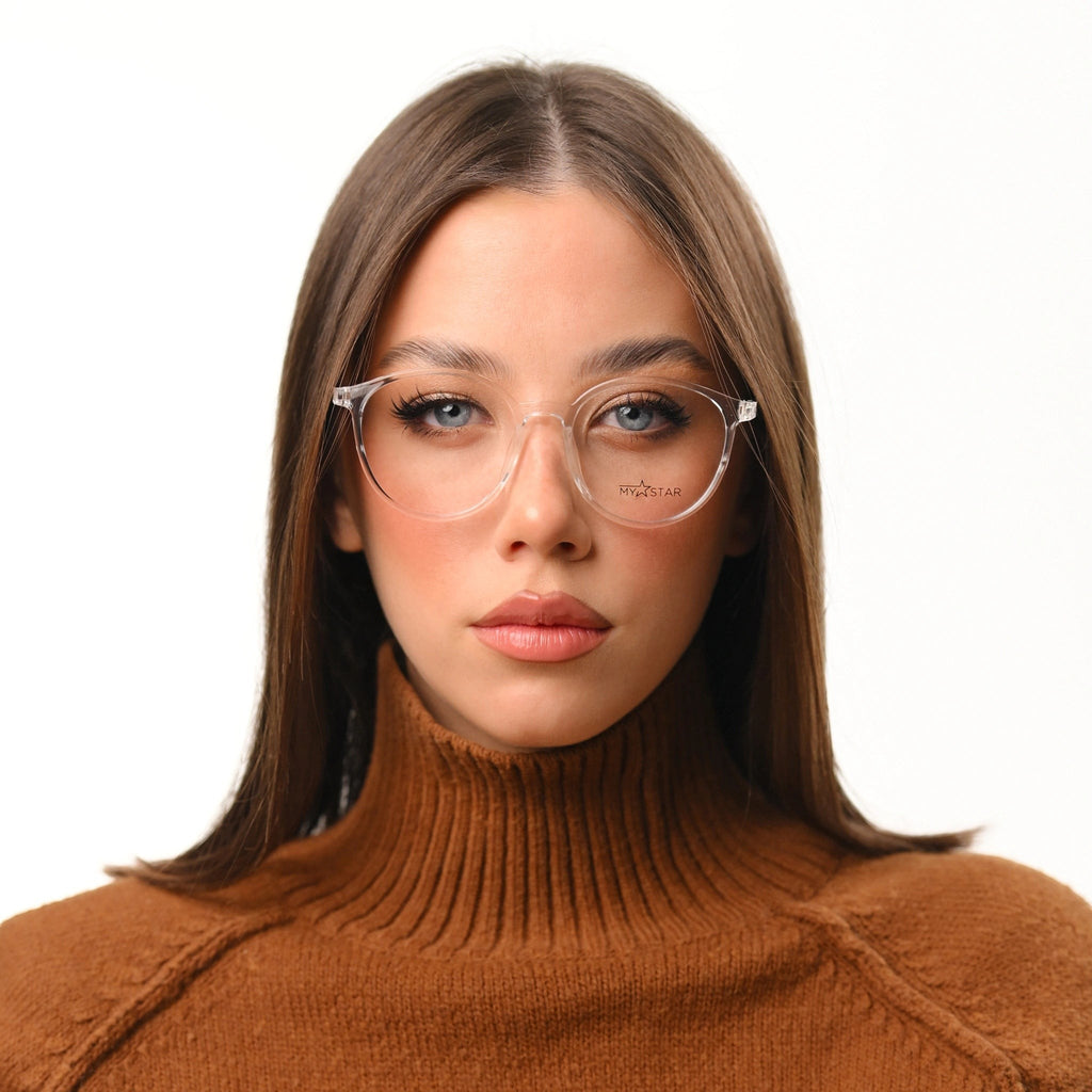 MyStar BOLD transparent round prescription glasses on a woman wearing a brown turtleneck.