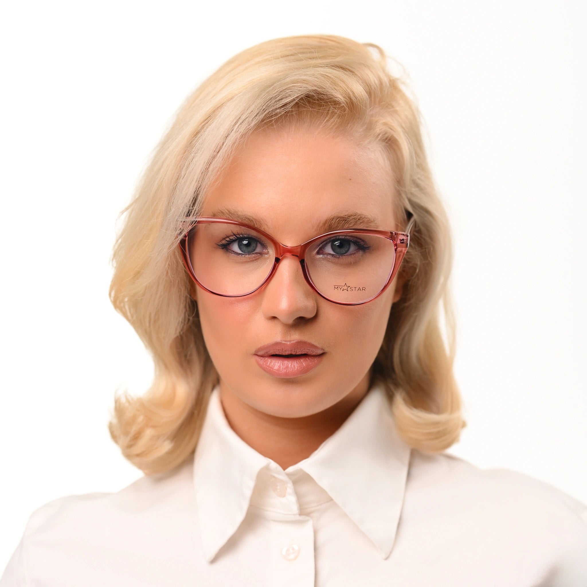Woman wearing pink glasses and a white shirt on a white background
