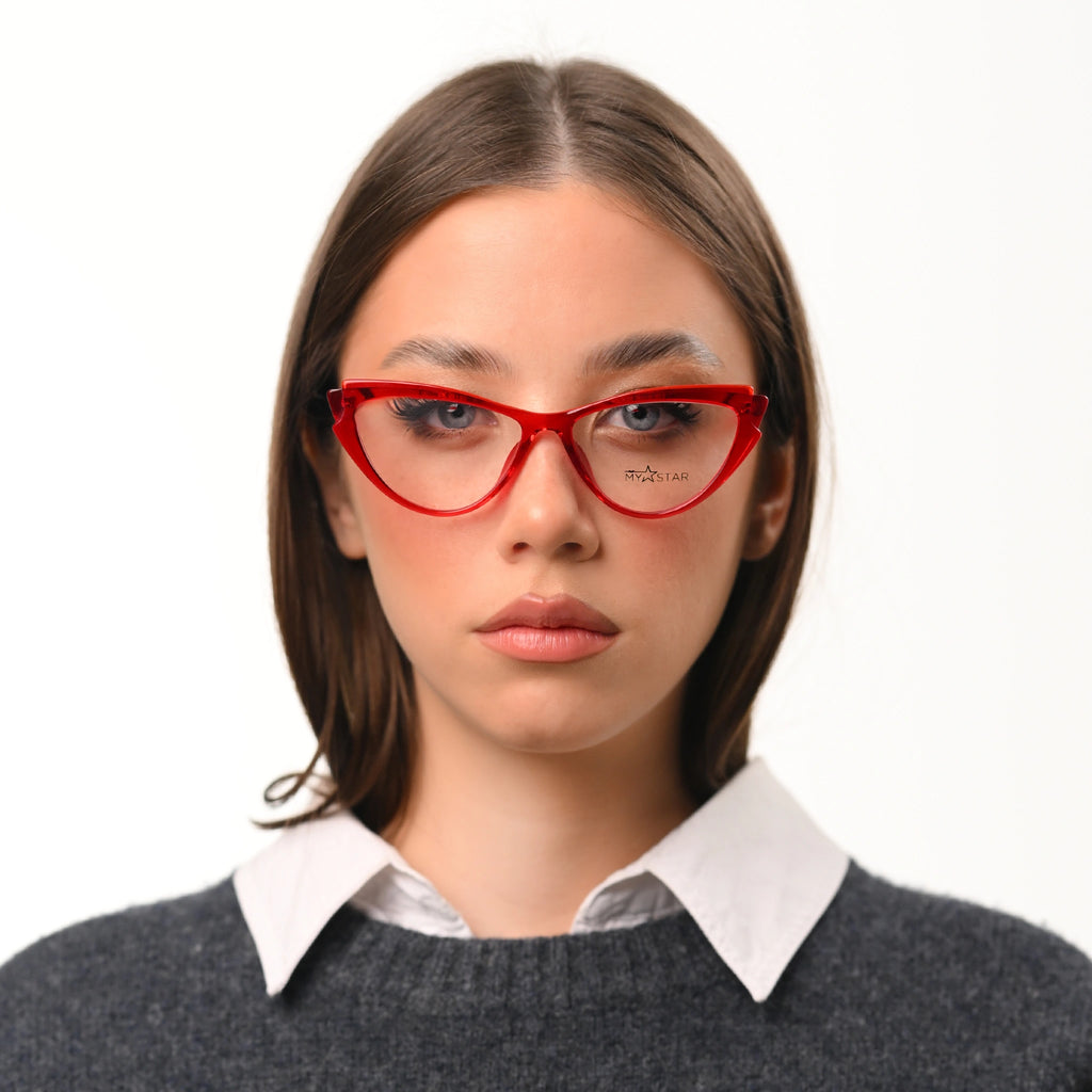 Person wearing red glasses with a plain background