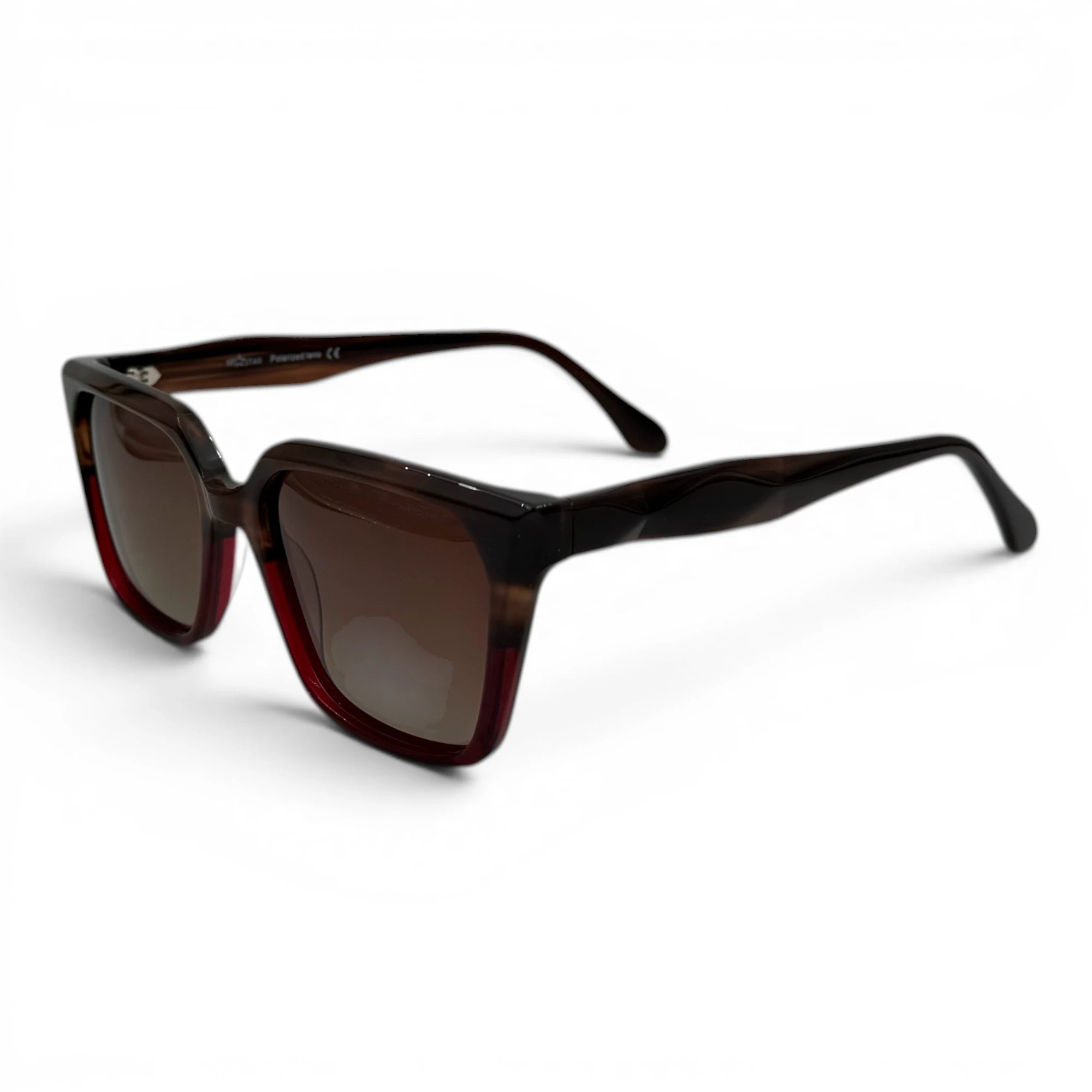Sunglasses with tortoiseshell frame and brown lenses on a white background