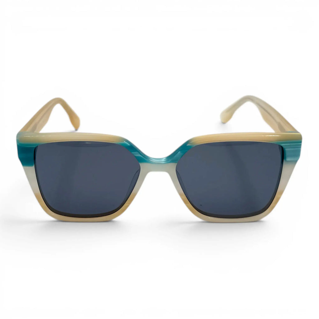 Sunglasses with blue and beige frame on a white background