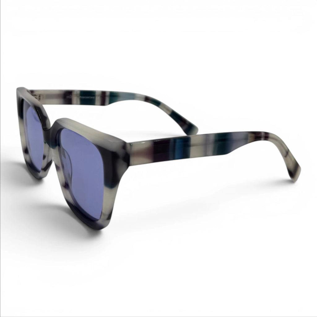 Sunglasses with a tortoiseshell frame and blue lenses on a white background