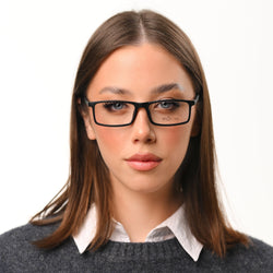Woman wearing glasses with a neutral background