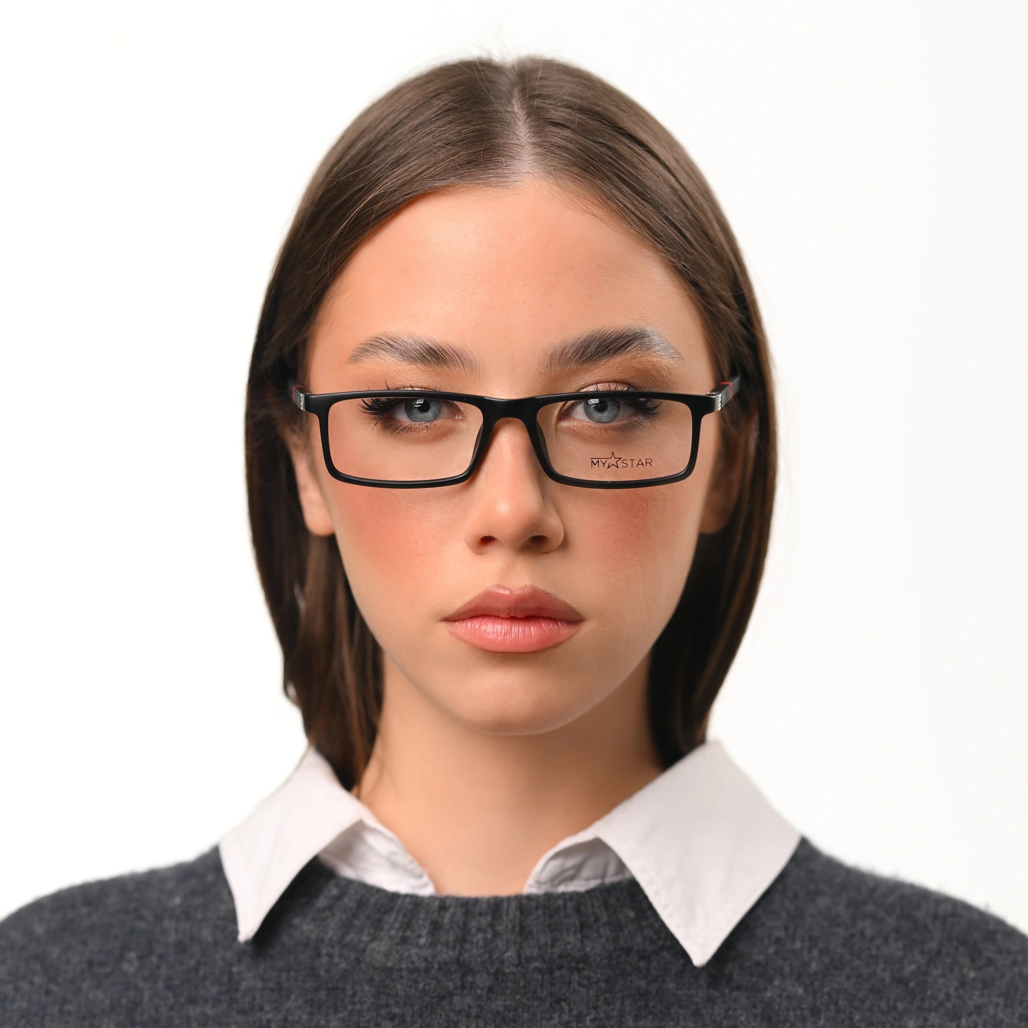 Woman wearing glasses with a plain background