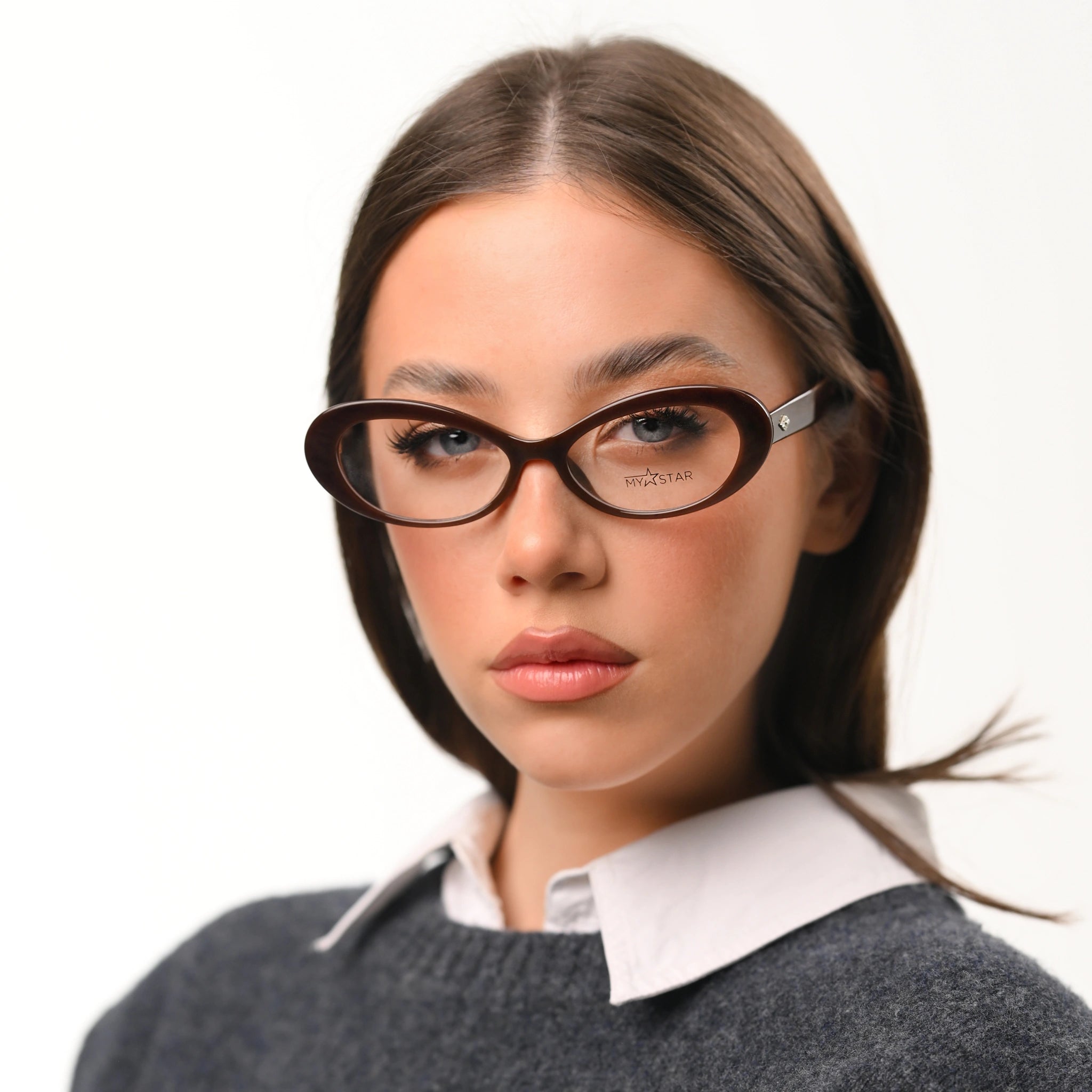Woman wearing glasses with a neutral background